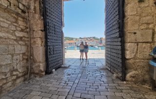 Krka Waterfalls two women standing at gates